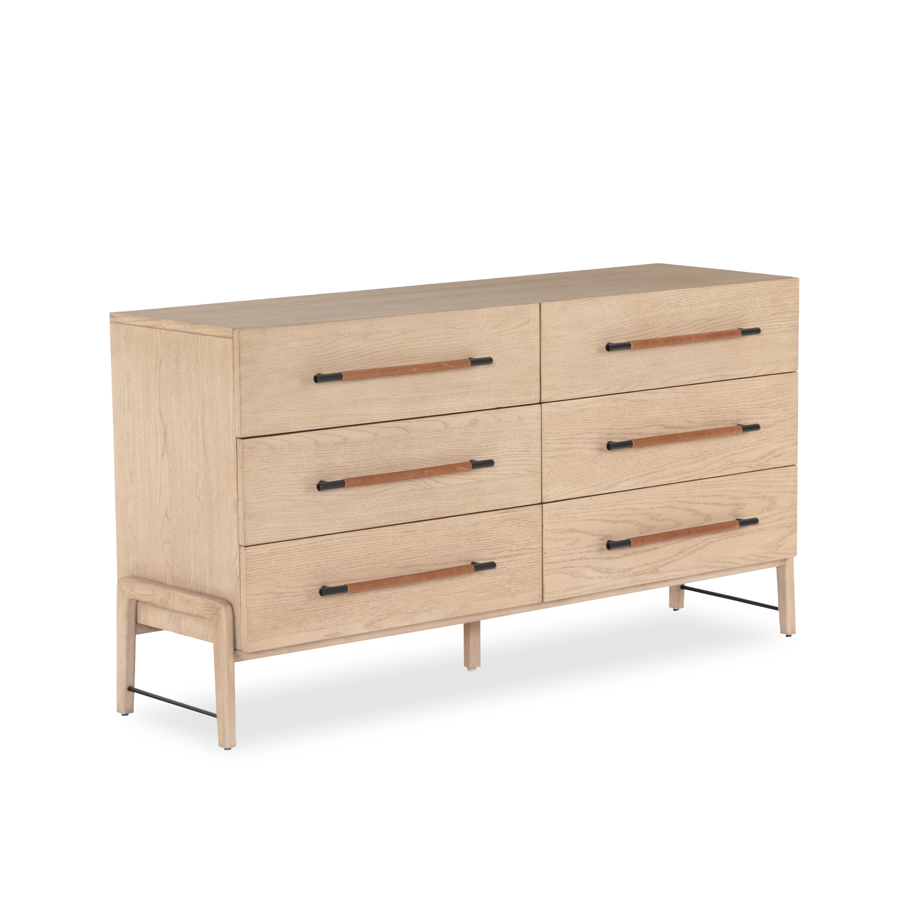 The Buckley Dresser features light-finished oak forming a clean silhouette for six spacious drawers with iron hardware wrapped in tan top-grain leather.