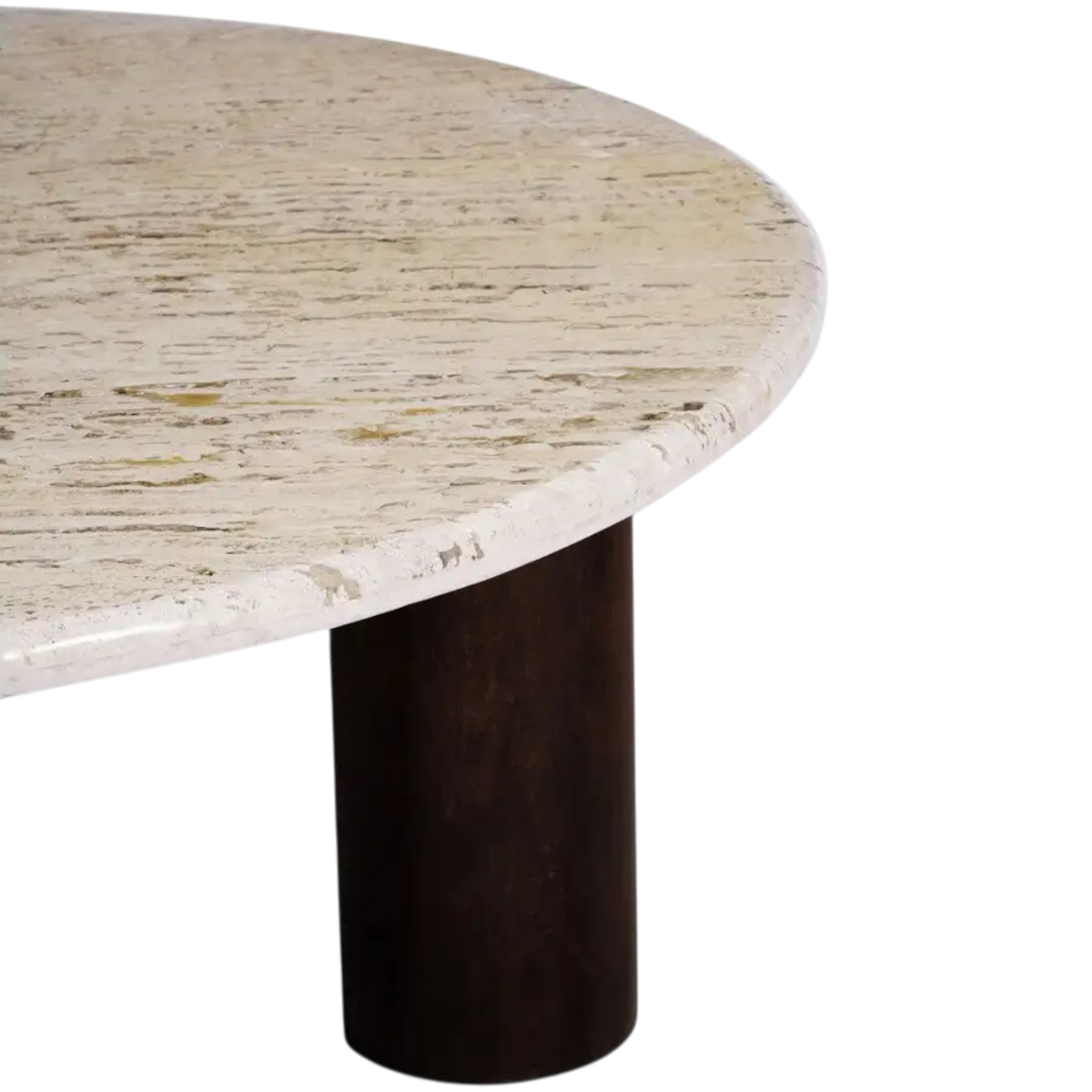 Close-up of the Forma Coffee Table showing the natural veining, pitting and softly rounded edge of the beige travertine top.