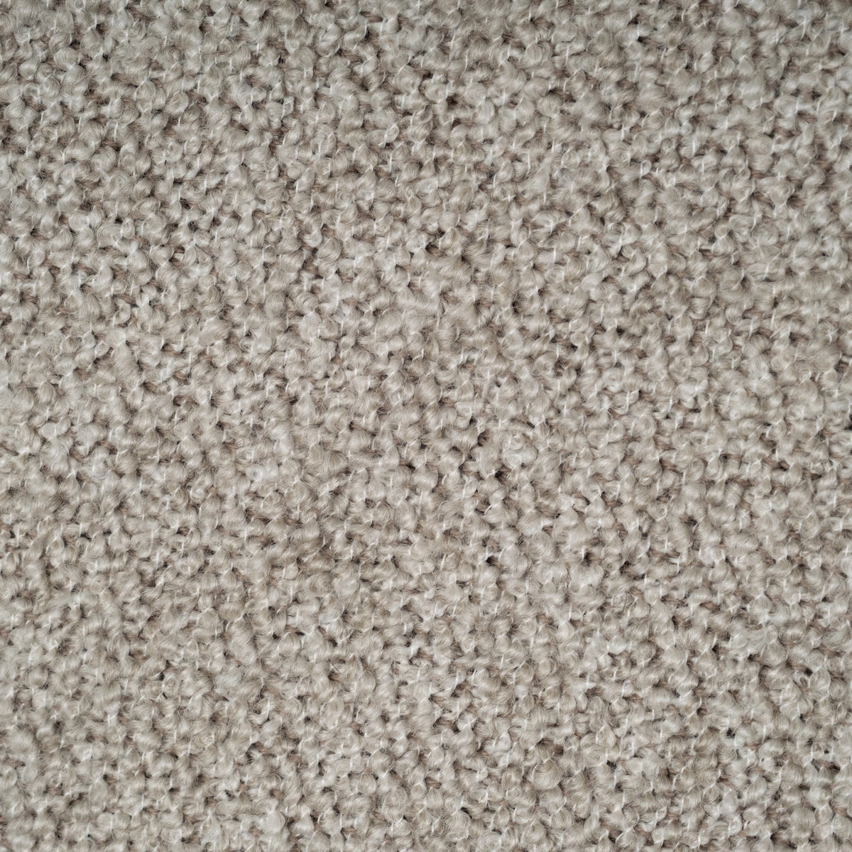 Close-up showing the Pebble textured fabric used on the Ease Sofa, with looped, bouclé-like yarns in warm gray-taupe.