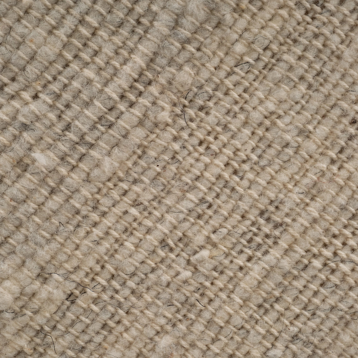 Close-up of the Trevino Bench upholstery, highlighting the woven natural fabric in soft beige tones.