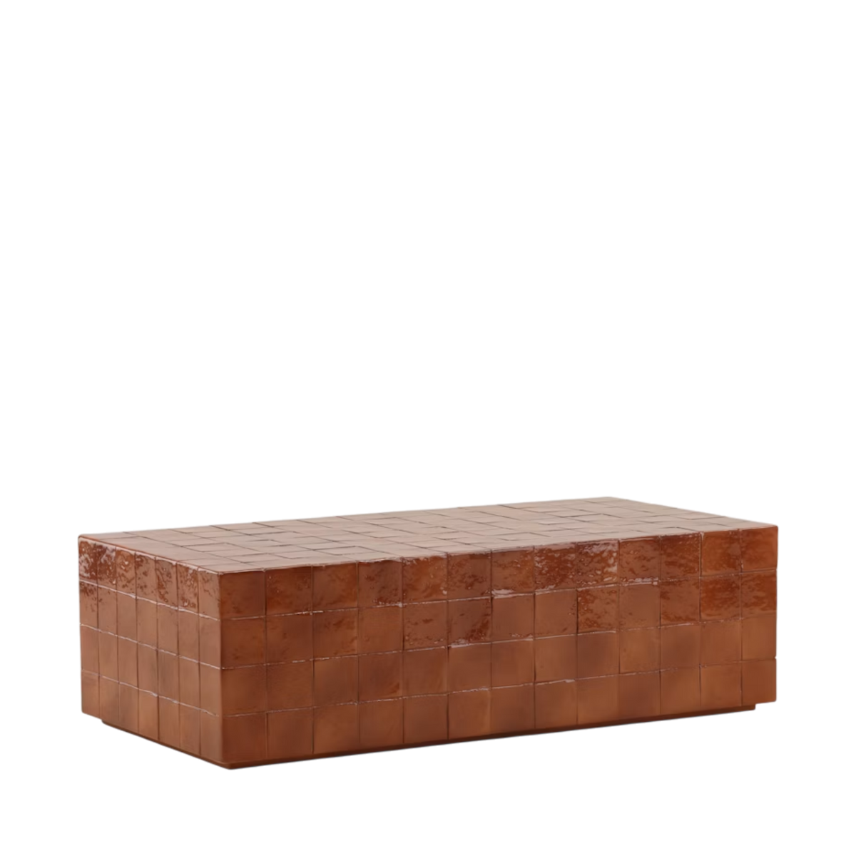 Angled view of the Tilo Coffee Table showing its block-like silhouette, tiled grid pattern and mottled rust-coloured finish wrapping across the top and sides.