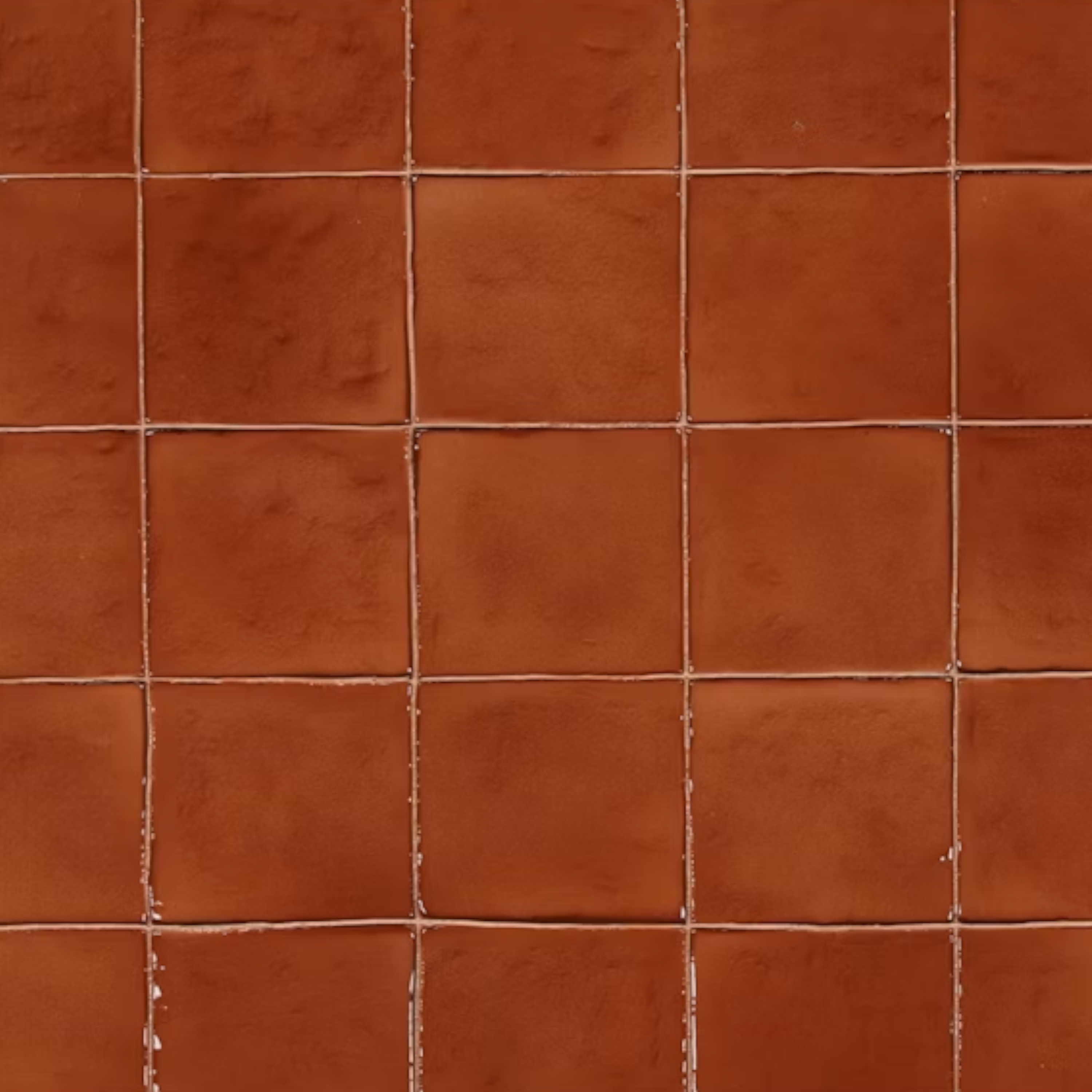 Close-up of the Tilo Coffee Table showing the warm terracotta Rust finish, irregular tile grid and subtle surface variation.