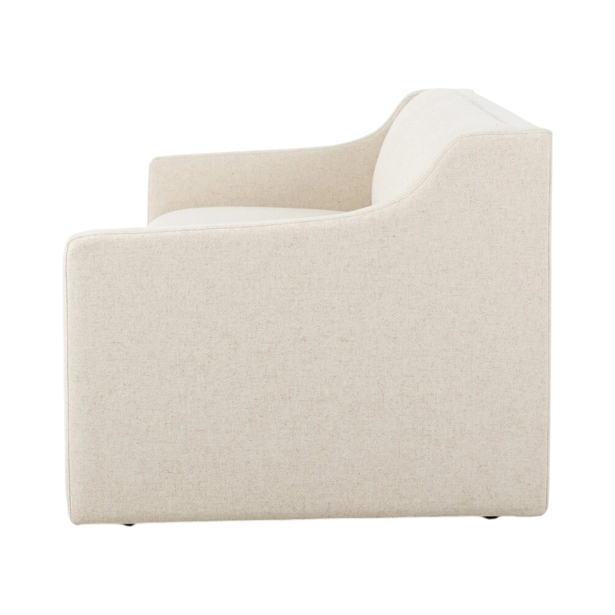 Side view of the Giselle Sofa highlighting the sculpted arm that rises toward the curved back and the fully upholstered low-profile frame.