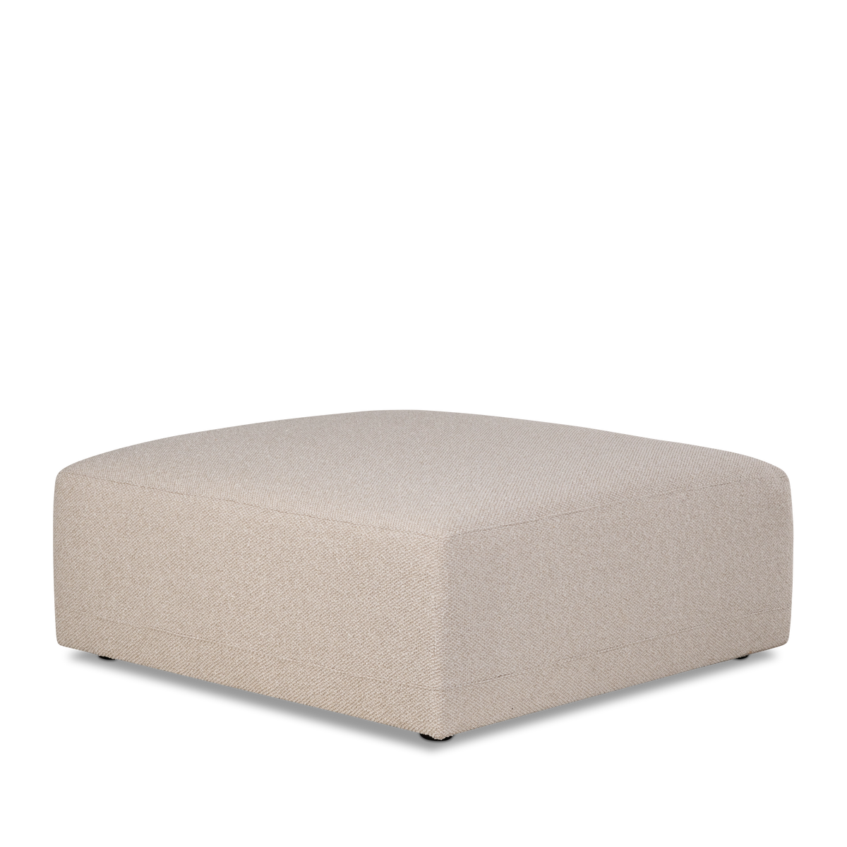 Angled view of the Arlo Modular Ottoman in Oatmeal woven fabric, showing the softly squared top, rounded corners and tailored seam lines.