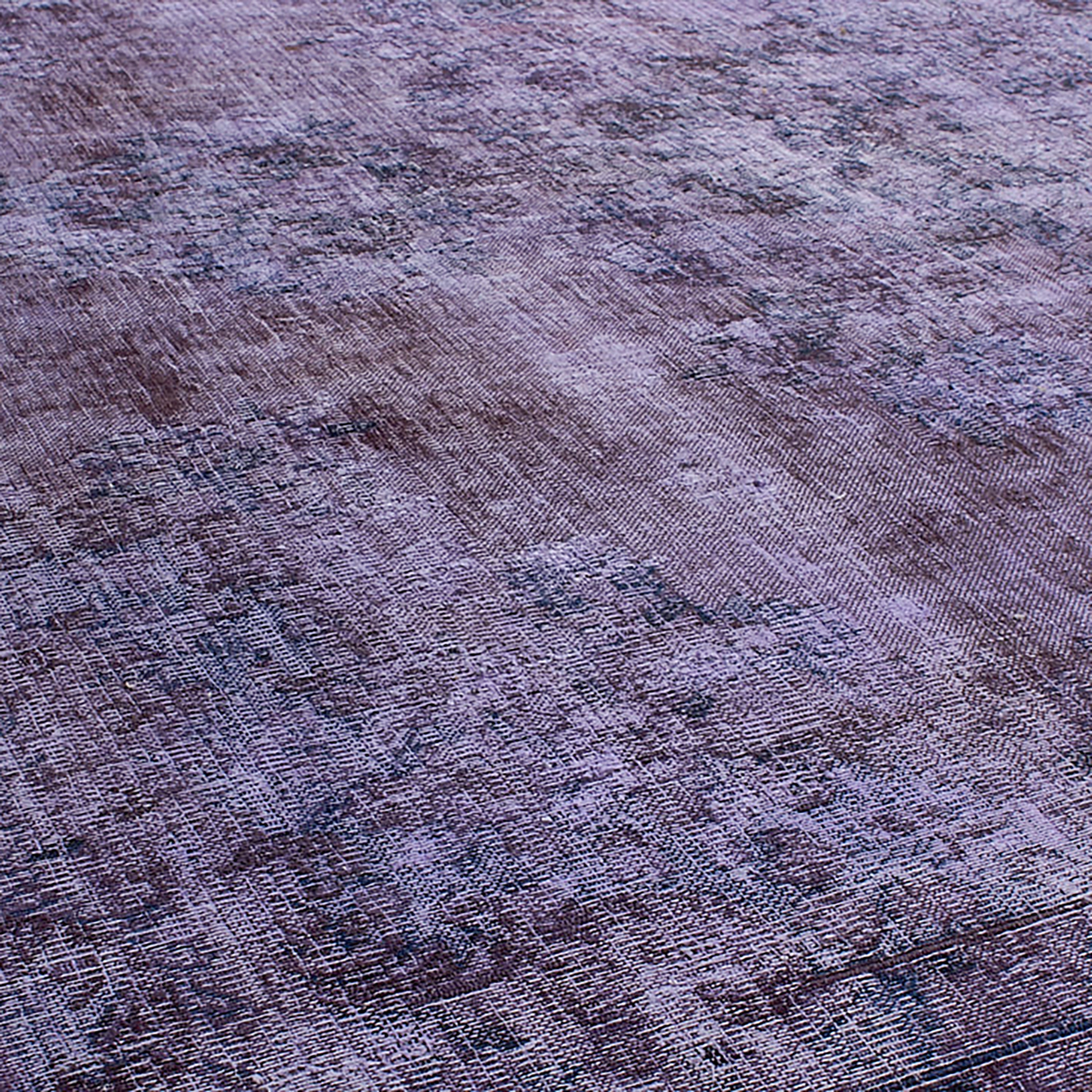 Antique Persian and Turkish rugs are stripped of their original colours, over-dyed and reborn, making each a one-of-a-kind piece.