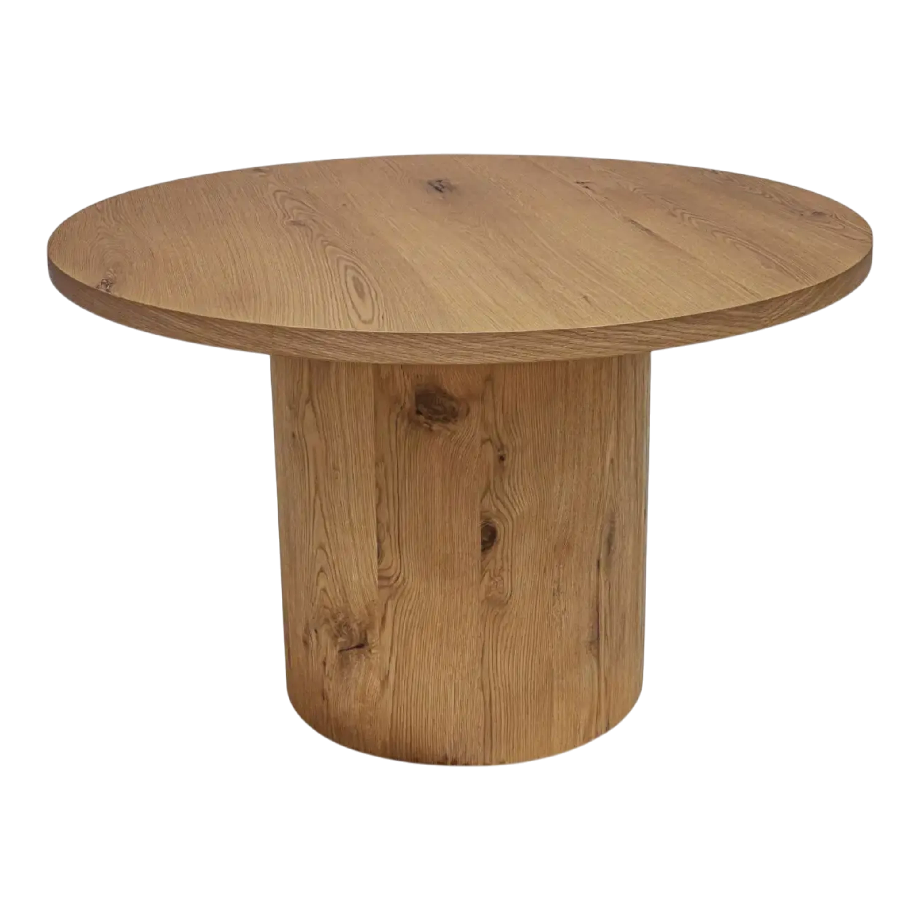 Weaver Dining Table in warm wood with a round top and cylindrical pedestal base, shown from an angled front view.