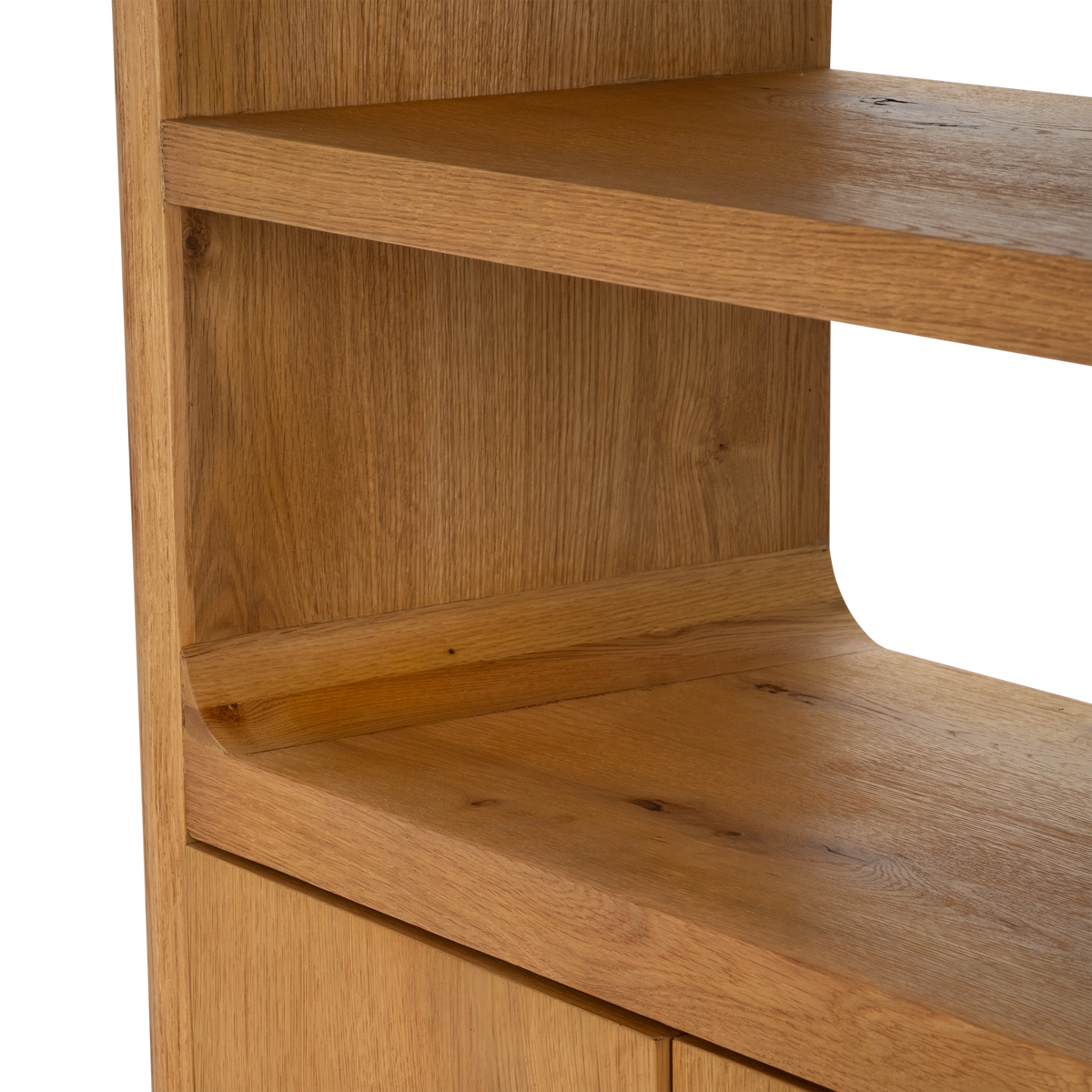 Edge Cabinet in an angled close-up highlighting the honey oak shelf edge, the rounded cove curve and the tops of the lower cabinet doors.