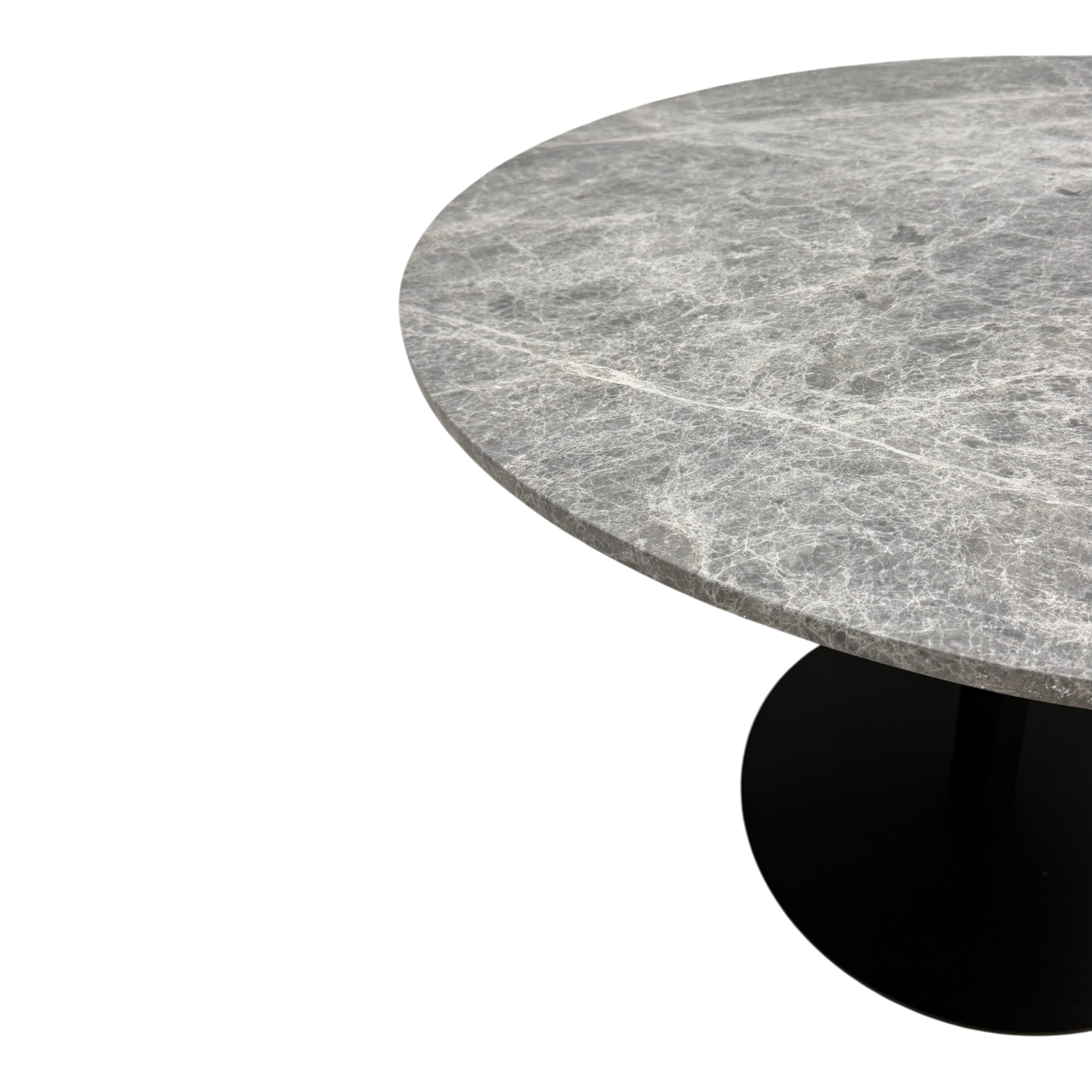 Bento Table. A close-up of a round dining table with a gray marble-look top featuring white veining and a black pedestal base, shown on a plain white background.