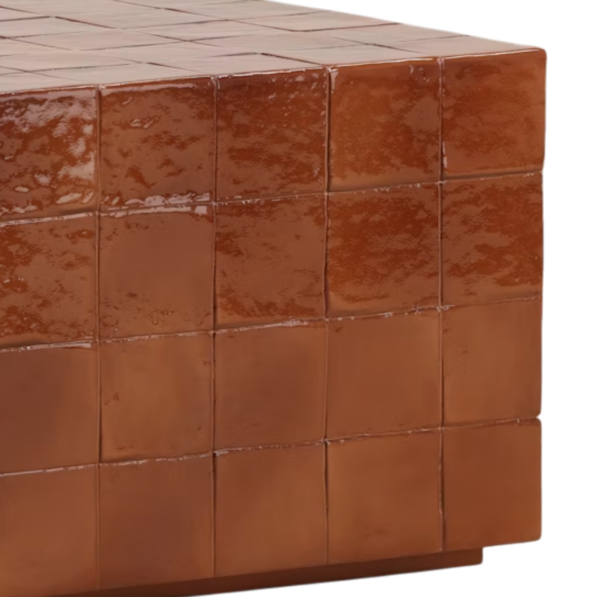 Detail view of the Tilo Coffee Table highlighting the glossy faux tile effect, mottled concrete surface and grid pattern wrapping over the table edge.