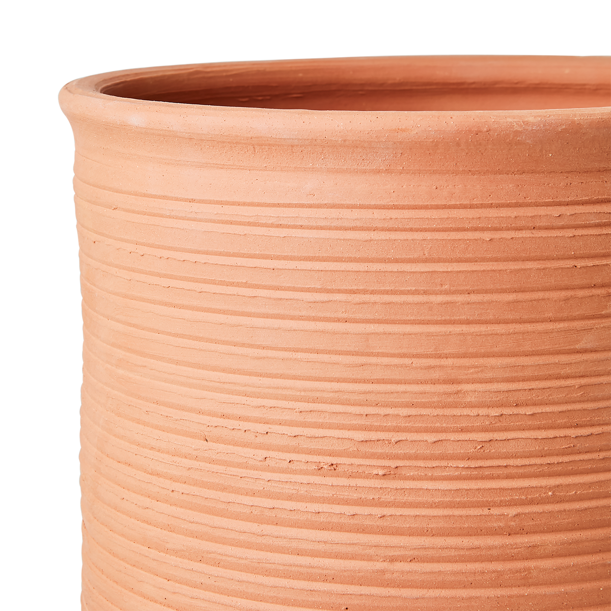 Hand-carved ridging and simple forms come together in the Ridge Terracotta Pot.