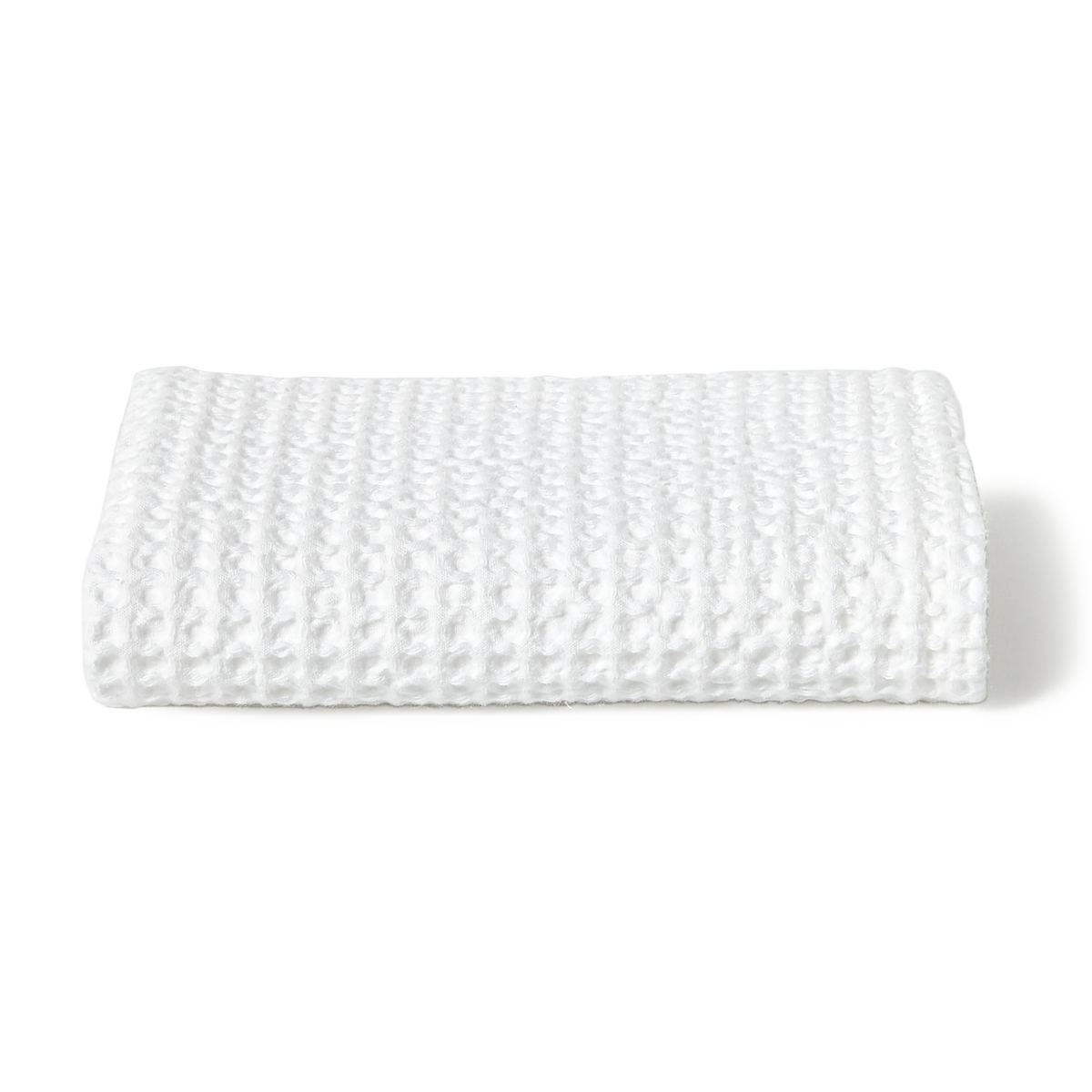 Made in Portugal from 100% cotton, the Stone Washed towel features a loomed waffle knit texture that is absorbent, quick to dry, and resistant to shrinkage.