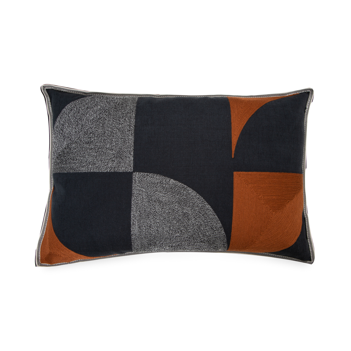 This pillow features a geometric play of angles and curves in relation to colours and textures.