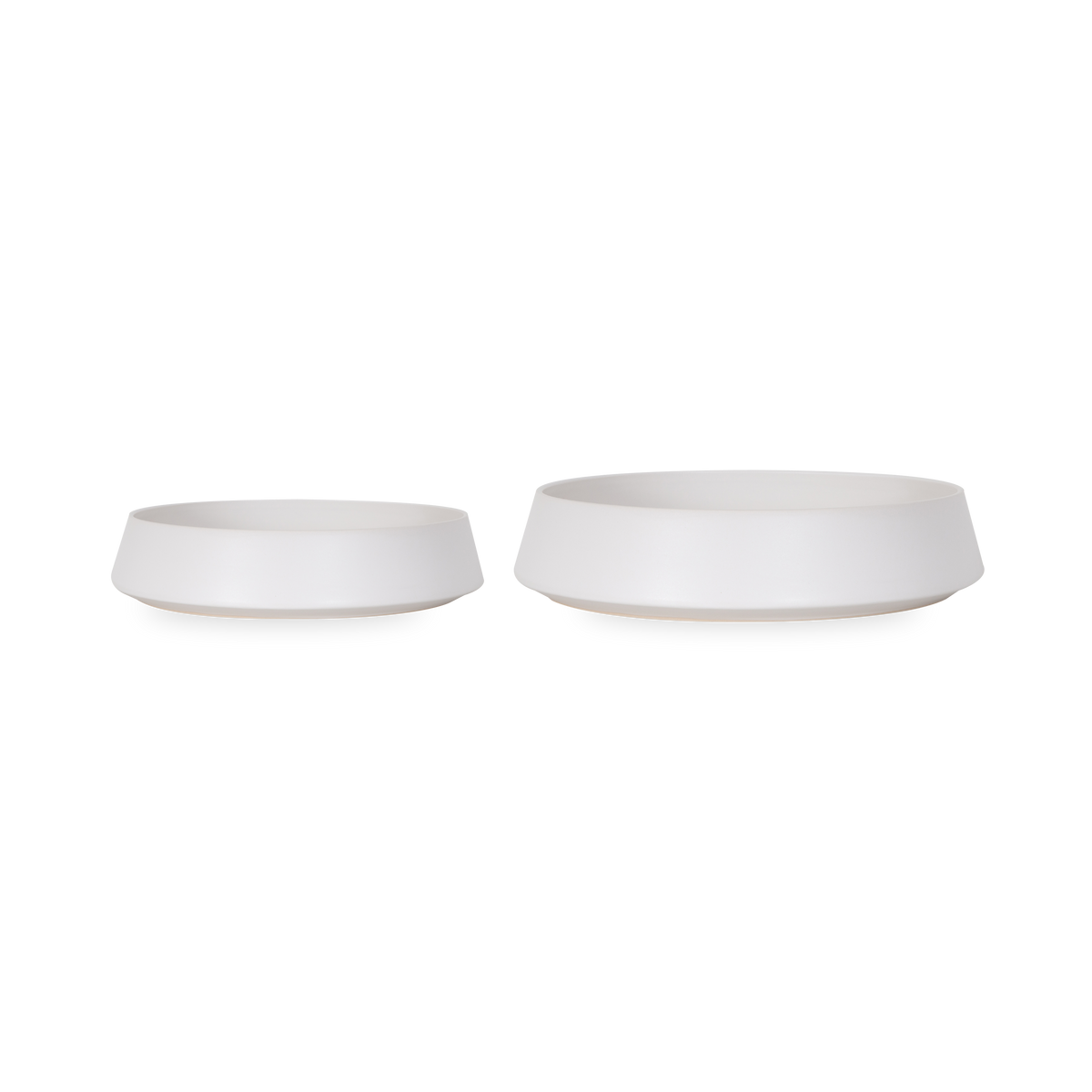 The Ceramic Serving Bowl features an elegant low-cut rounded body that is finished in a smooth matte white.